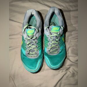 Nike Women's Teal and Gray Athletic Running Shoes with Neon Yellow Accents